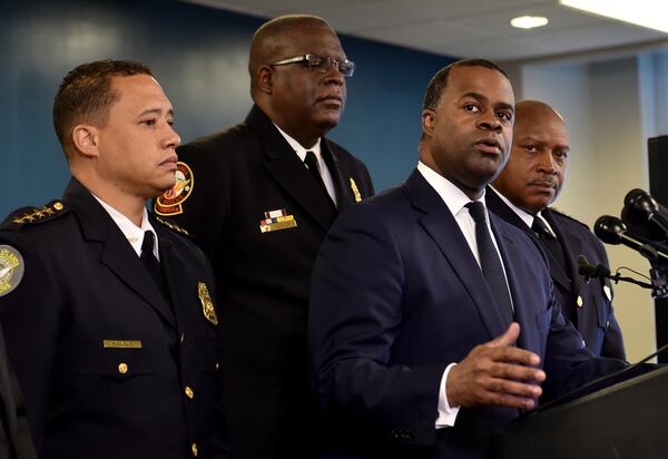 Left to right: Patrick Labat, then-chief of the Atlanta Department of Corrections; Joel Baker, then-chief of the Atlanta Fire Department; Kasim Reed, then-mayor of Atlanta; and George Turner, then-chief of the Atlanta Police Department, at an Atlanta public safety press conference in February 2016. (credit: Brant Sanderlin/AJC file photo)