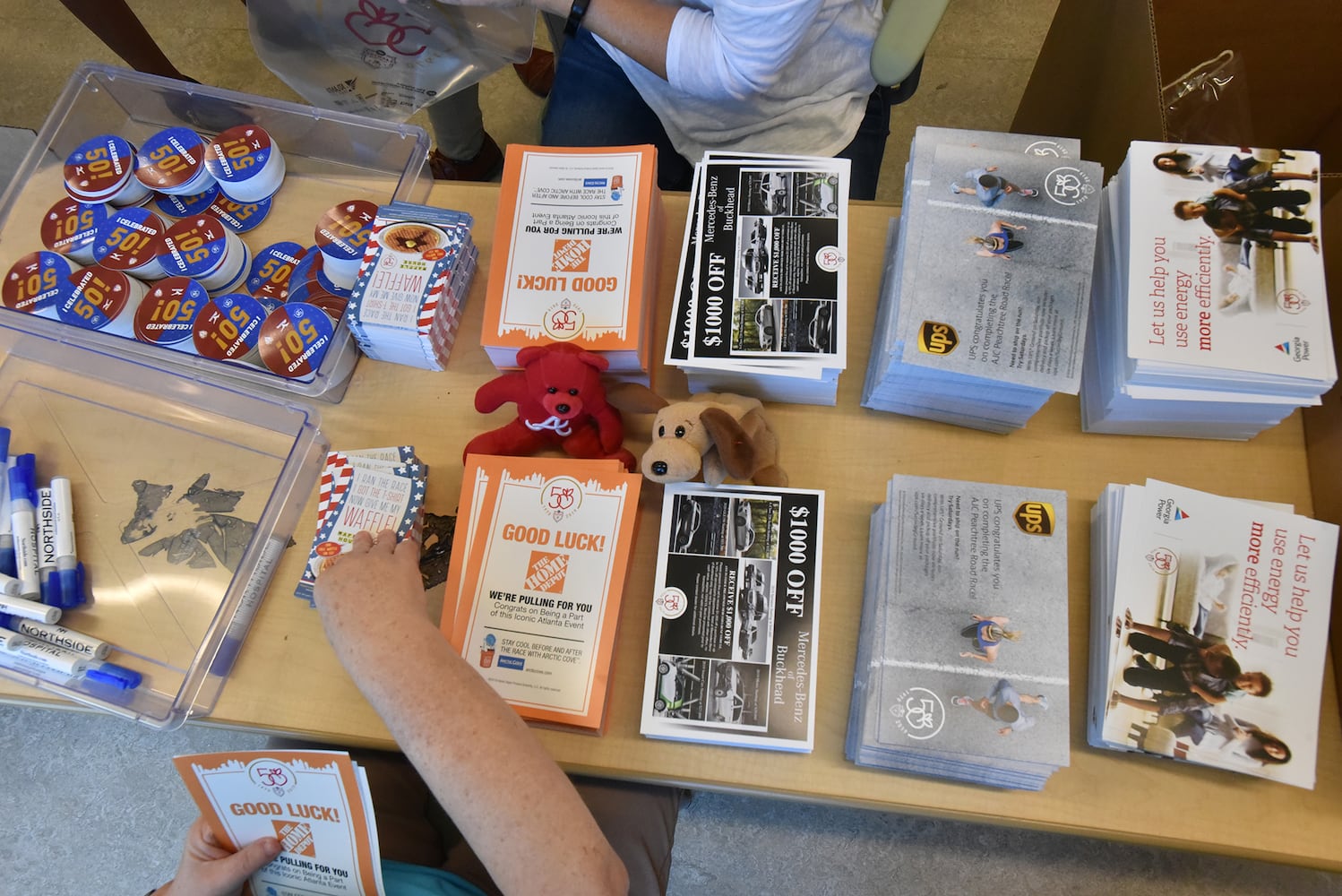 Volunteers prepare for the AJC Peachtree Road Race