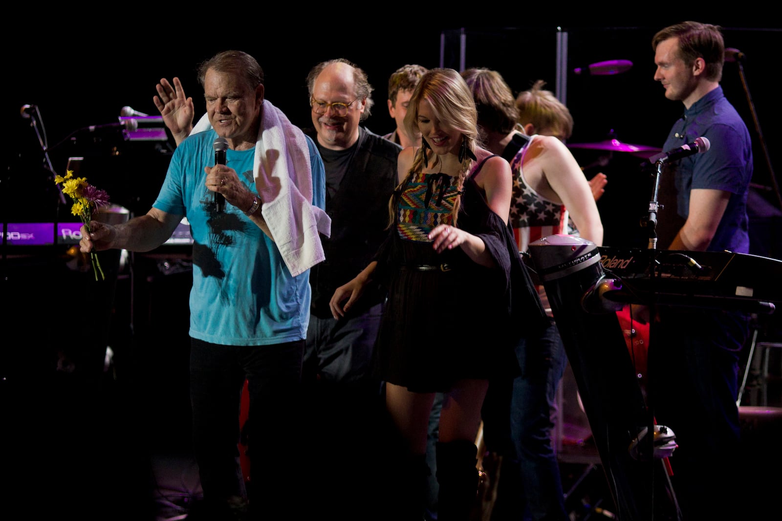 071412 Atlanta: A fan presents Glen Campbell with flowers following his set on Saturday, July 14, 2012. Max Blau Special A fan presents Glen Campbell with flowers following his set at Chastain. Photo: Max Blau Special to the AJC.