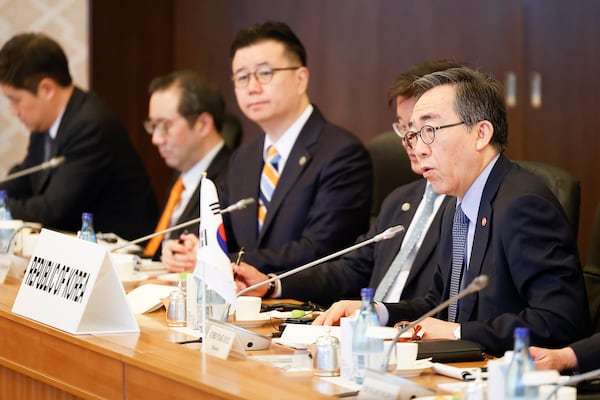 South Korean Foreign Minister Cho Tae-yul, right, speaks during their trilateral foreign ministers’ meeting with China and Japan in Tokyo Saturday, March 22, 2025.(Rodrigo Reyes Marin/Pool Photo via AP)