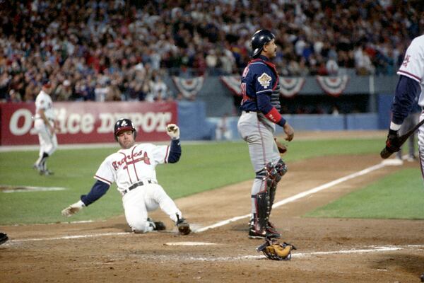 Mark Lemke scores a run in Game 2 of the 1995 World Series.