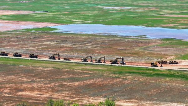 From an aerial vantage point of the Rivian Plant, there is minor to no movement among the heavy machinery after the corporation's recent decision to halt the extensive construction efforts at the Georgia location. Tuesday, March 19, 2024.
Miguel Martinez /miguel.martinezjimenez@ajc.com