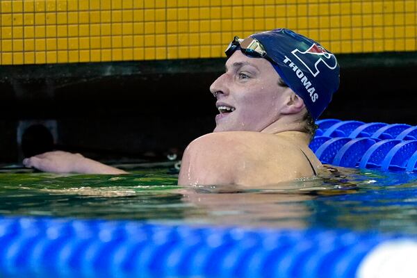 Lia Thomas, a transgender woman competing for the University of Pennsylvania, smiles after winning a preliminary heat in the 500-yard freestyle at the NCAA women's swimming and diving championships at Georgia Tech in March. (AP Photo/John Bazemore)