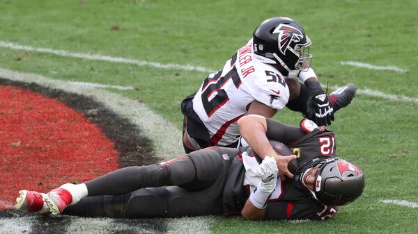 Atlanta Falcons defensive end Dante Fowler Jr. (56) sacks Tampa Bay Buccaneers quarterback Tom Brady (12) during the second half Sunday, Jan. 3, 2021, in Tampa, Fla. (Mark LoMoglio/AP)