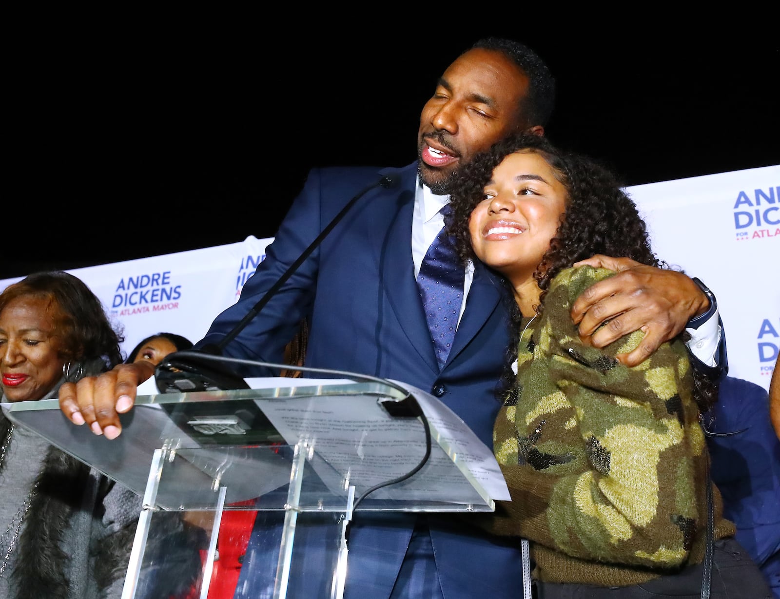 113021 Atlanta: Atlanta Mayor-elect Andre Dickens gives his daughter a hug during his victory address at his election night watch party on Tuesday, Nov. 30, 2021, at the Gathering Spot in Atlanta.   “Curtis Compton / Curtis.Compton@ajc.com”`