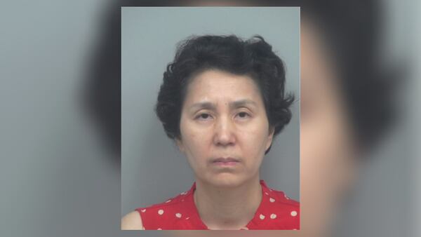 Mihee Lee was arrested Wednesday after a woman's body was found inside a vehicle in Gwinnett County last month.