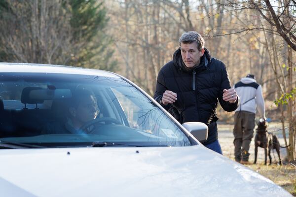 Director Glen Owen (right) sets up a driving scene with Michael Mosley (in car) during filming of "Signing Day," which was produced and filmed in Georgia.