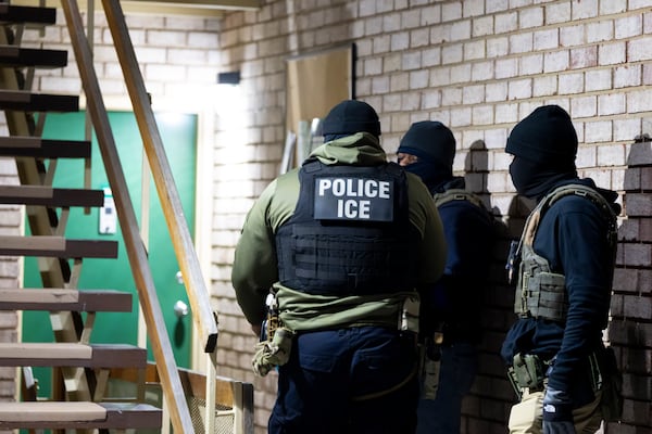 U.S. Immigration and Customs Enforcement officers wait to detain a person, Monday, Jan. 27, 2025, in Silver Spring, Md. (AP Photo/Alex Brandon)