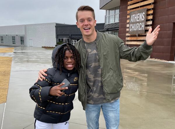 Zac Hendrix (right), a UGA graduate who has mentored Taeden Johnson since he was a third-grader, has come to Taeden's aid after he lost his family and most of his possessions in a fatal house fire in Athens on Jan. 27. (Photo courtesy Zac Hendrix)