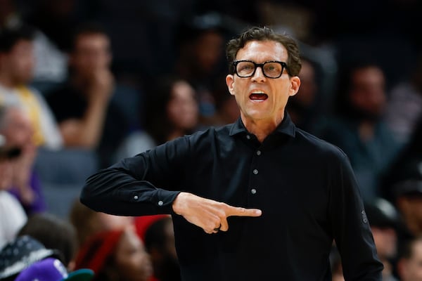 Atlanta Hawks head coach Quin Snyder calls a play during the first half of an NBA basketball game against the Charlotte Hornets in Charlotte, N.C., Tuesday, March 18, 2025. (AP Photo/Nell Redmond)