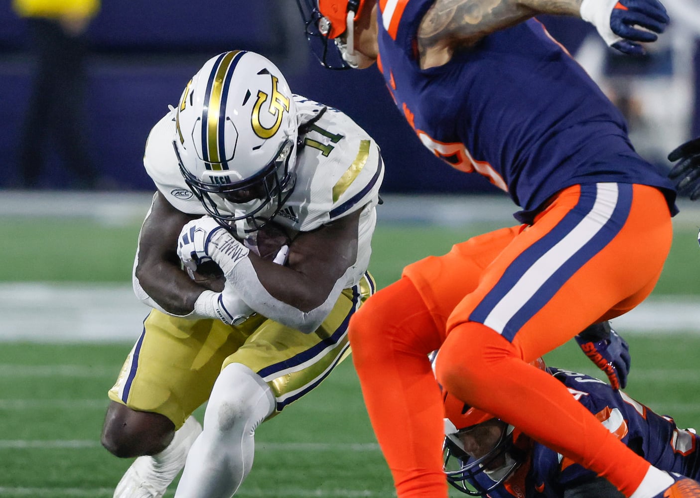 Georgia Tech Yellow Jackets running back Jamal Haynes (11) breaks through the line for an 11 yard gain during the second half of an NCAA college football game between Georgia Tech and Syracuse in Atlanta on Saturday, Nov. 18, 2023.  Georgia Tech won, 31 - 22. (Bob Andres for the Atlanta Journal Constitution)