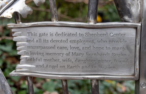 The iron gate is dedicated to Eric Busko's late wife Mary. PHIL SKINNER FOR THE ATLANTA JOURNAL-CONSTITUTION