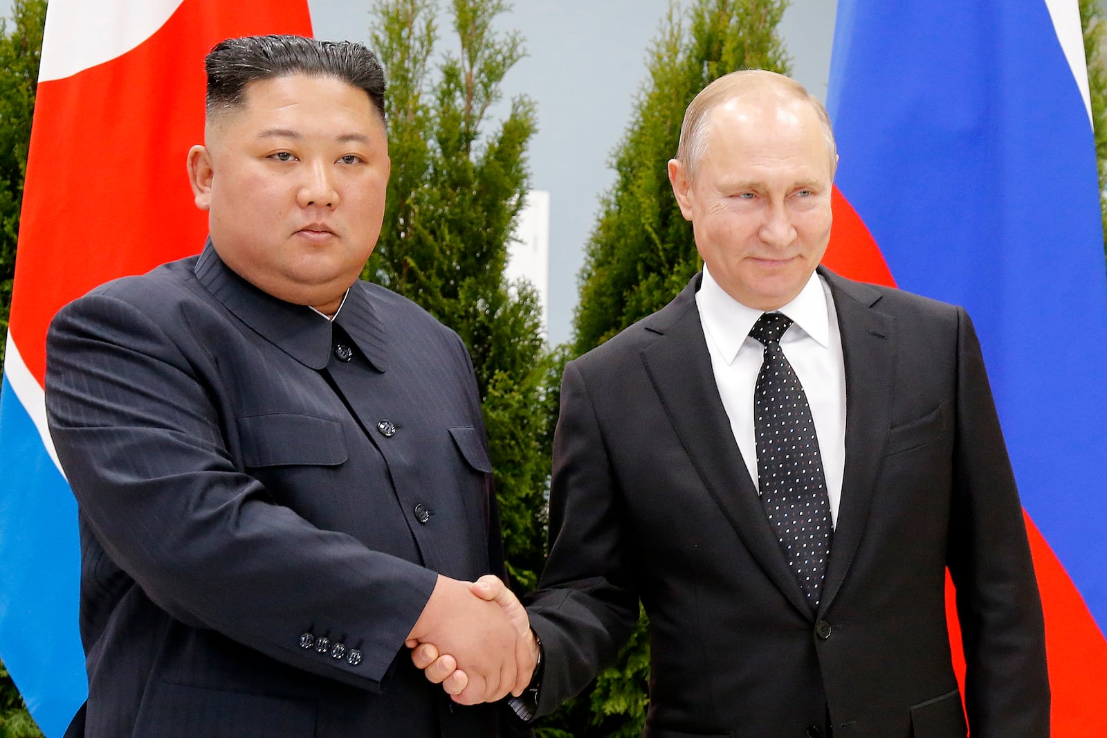 FILE - Russian President Vladimir Putin, right, and North Korea's leader Kim Jong Un shake hands during their meeting in Vladivostok, Russia, on April 25, 2019. (AP Photo/Alexander Zemlianichenko, Pool, File)