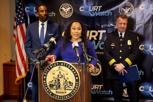 061322 Atlanta: Fulton County District Attorney Fani Willis, center, hosts a press conference with Atlanta mayor Andre Dickens, left, and Interim Atlanta Police Chief Darin Schierbaum, right, at the Fulton County courthouse Monday, June 13, 2022, in Atlanta. They discussed the new Community Court Watch program. (Jason Getz / Jason.Getz@ajc.com)