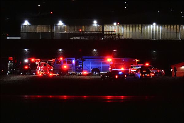 First responders are seen at Ronald Reagan Washington National Airport, Wednesday, Jan. 29, 2025, in Arlington, Va. (AP Photo/Julio Cortez)