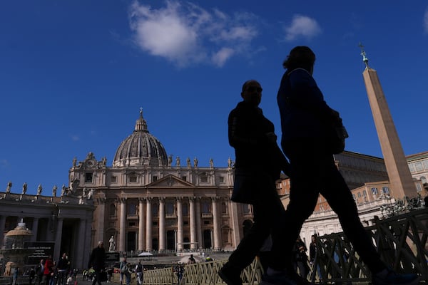 People visit St Peter's Square at The Vatican, Thursday, Feb. 27, 2025. (AP Photo/Kirsty Wigglesworth)