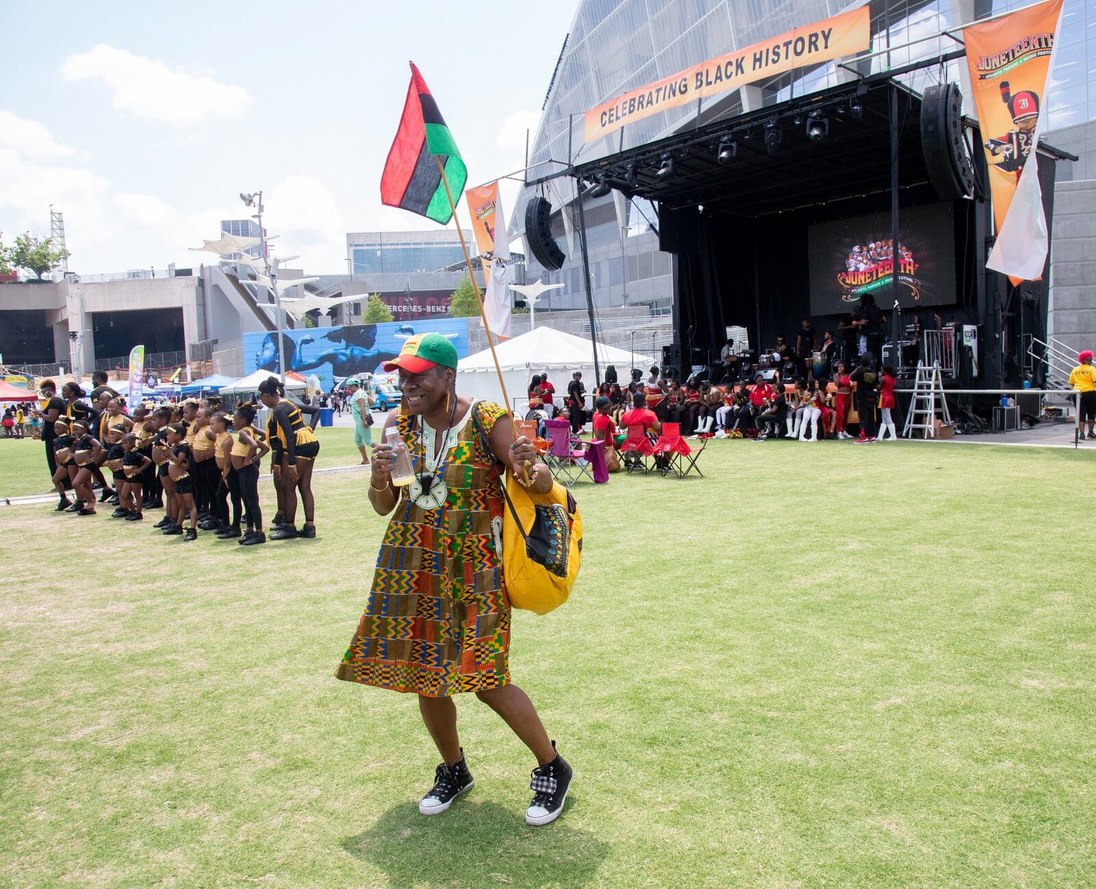 Sharon Ann Smith dances to the music at the Home Depot Backyard at the Mercedes-Benz Stadium at the end of the Juneteenth Atlanta Black History Parade in Atlanta on June 15, 2019.