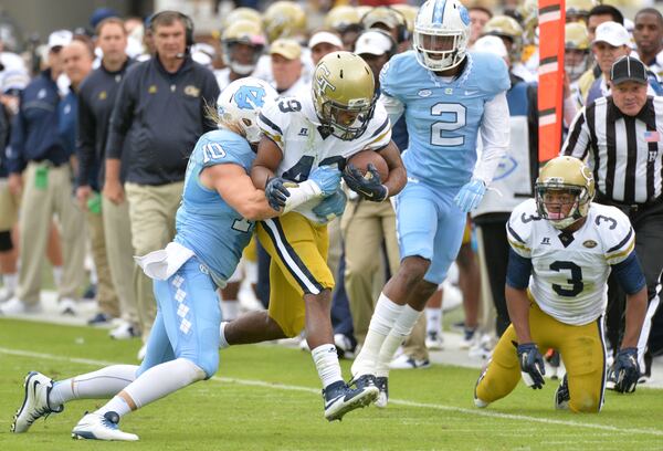 October 3, 2015 Atlanta - Georgia Tech Yellow Jackets running back Clinton Lynch (49) eludes a tackle by North Carolina Tar Heels linebacker Jeff Schoettmer (10) in the first half at Bobby Dodd Stadium on Saturday, October 3, 2015. HYOSUB SHIN / HSHIN@AJC.COM