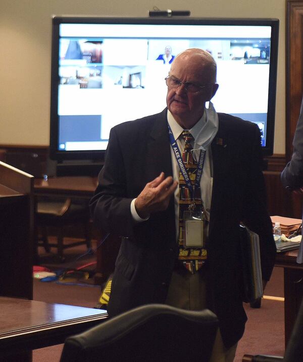 Prosecutor John B. Johnson III heads back to his area during the hearing for Dennis Perry.  RYON HORNE (AJC)