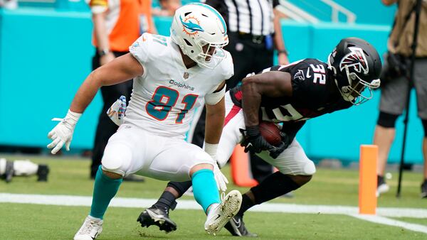 Atlanta Falcons safety Jaylinn Hawkins (32) intercepts a pass in the endzone intended for Miami Dolphins tight end Durham Smythe (81) during the first half Sunday, Oct. 24, 2021, in Miami Gardens, Fla. (AP Photo/Wilfredo Lee)