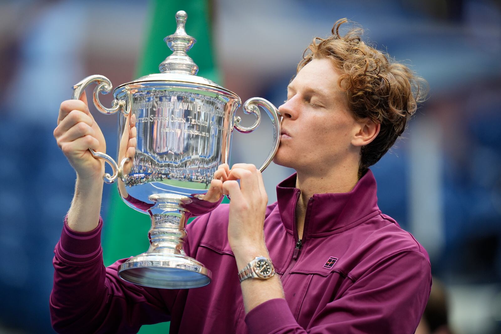 Jannik Sinner, of Italy, kisses the championship trophy after defeating Taylor Fritz, of the United States, in the men's singles final of the U.S. Open tennis championships, Sunday, Sept. 8, 2024, in New York. (AP Photo/Seth Wenig)