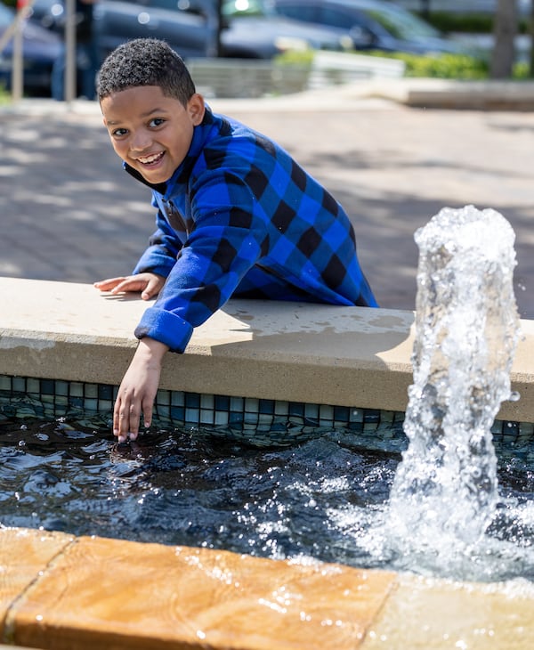 Immanuel Stephens plays at the Sandy Springs City Green Park. PHIL SKINNER FOR THE ATLANTA JOURNAL-CONSTITUTION