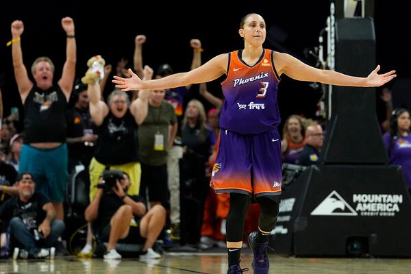 FILE - Phoenix Mercury's Diana Taurasi (3) celebrates after making her 10,000th career point during the second half of a WNBA basketball game against the Atlanta Dream, Thursday, Aug. 3, 2023, in Phoenix. (AP Photo/Matt York, File)