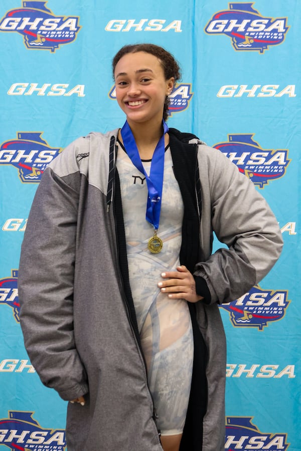 Midtown  High School's Sarah Paisley Owen after winning a gold medal in the 100-yard freestyle at the 2024 GSHA championships.