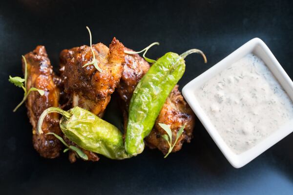 Chicken wings with shishito peppers, chili-garlic sauce, and Amara ranch dressing. Photo credit: Mia Yakel.