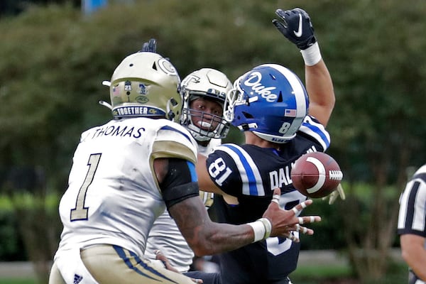 Georgia Tech defensive back Juanyeh Thomas (1) intercepts a pass intended for Duke tight end Nicky Dalmolin (81) in the closing seconds of the second half to seal the win for Georgia Tech during an NCAA college football game in Durham, N.C., Saturday, Oct. 9, 2021. (AP Photo/Chris Seward)