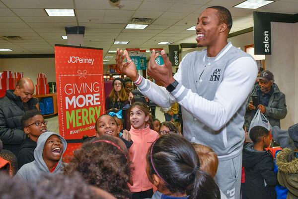 JCPenney, in partnership with the Y, spreads joy to local communities across the country by hosting giving sprees throughout the month like this one held at Northlake Mall on Tuesday, Dec. 20, 2016, in Atlanta. NBA basketball player Dwight Howard is shown. (Photo by John Amis/Invision for JCPenney/AP Images)