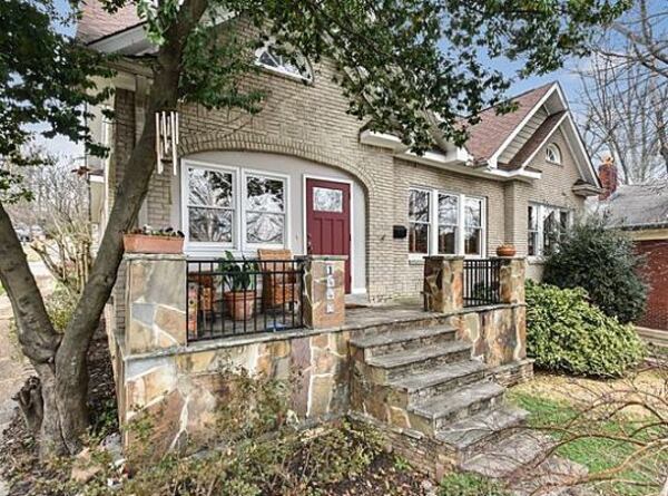 This bungalow has a large master retreat as well as 1920s-era stained glass windows.