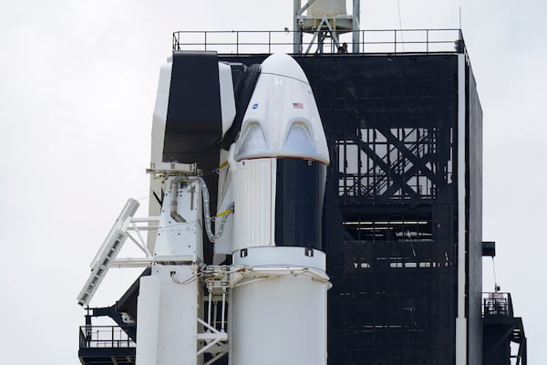 The SpaceX Falcon 9, with Dragon crew capsule on top of the rocket, sits on Launch Pad 39-A on Friday. Officials hope to launch at 3:22 p.m. Saturday in Cape Canaveral, Florida.