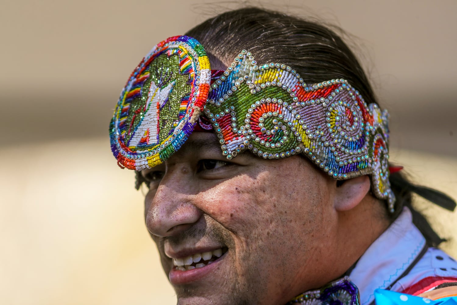 Otter Oliver, a Cree/Dakota smiles after performing a Gras Dance from the Oklahoma Territory on Friday, Nov. 3, 2023, at Stone Mountain Park during the Native American Festival & Pow Wow. It is considered the largest gathering of its kind in Georgia with multiple indigenous tribes represented.  (John Spink / John.Spink@ajc.com)


