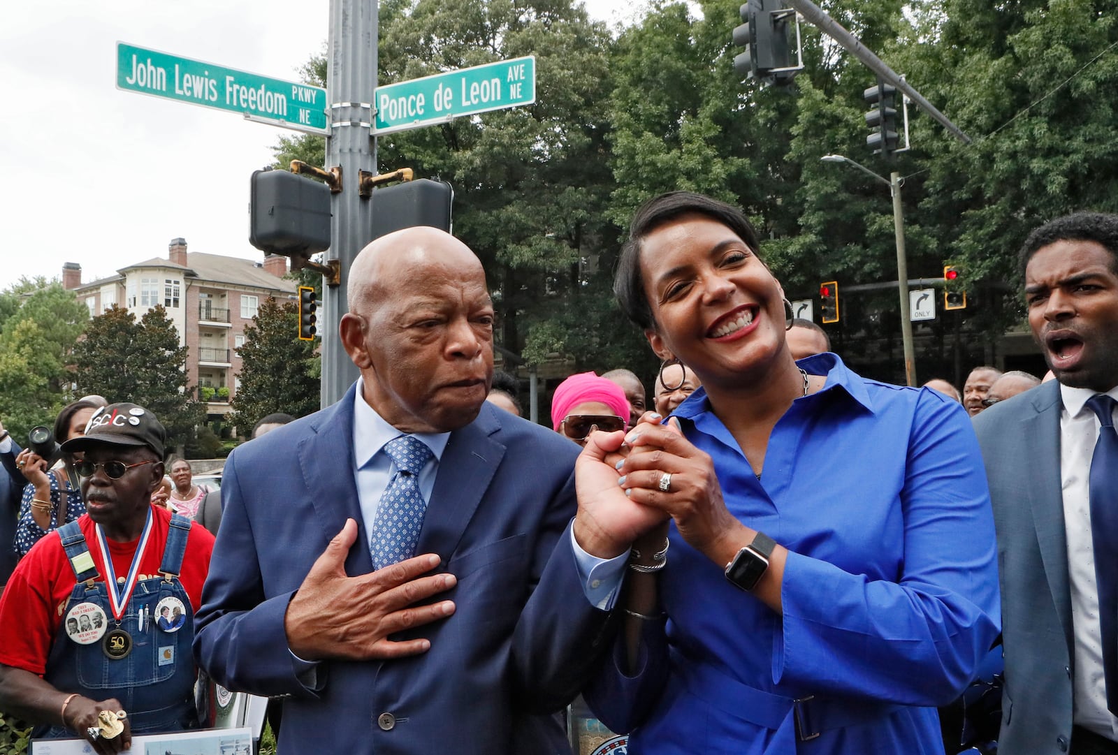 U.S. Rep. John Lewis and Mayor Keisha Lance Bottoms celebrate together after Freedom Parkway was renamed “John Lewis Freedom Parkway” during a dedication ceremony and sign unveiling in 2018. (BOB ANDRES /BANDRES@AJC.COM)