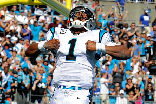 Carolina Panthers' Cam Newton (1) celebrates his touchdown run against the New York Giants during the second half of an NFL football game in Charlotte, N.C., Sunday, Sept. 22, 2013. (AP Photo/Mike McCarn) Carolina quarterback Cam Newton celebrating after scoring a touchdown against the New York Giants last December. (Associated Press)