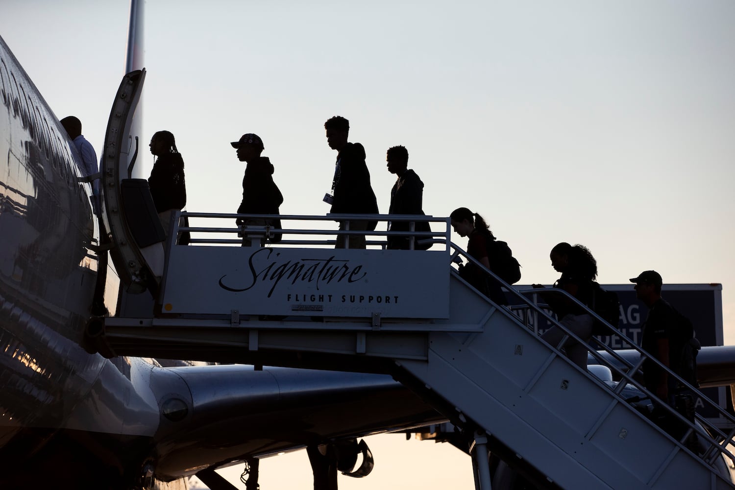 Participants of Delta’s Dream Flight 2022 event board a plane at Hartsfield-Jackson Atlanta International Airport on Friday, July 15, 2022. Around 150 students ranging from 13 to 18 years old will fly from Atlanta to the Duluth Air National Guard Base in Duluth, Minnesota. (Chris Day/Christopher.Day@ajc.com)