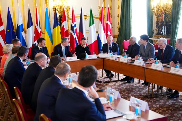 Canada Prime Minister Justin Trudeau, third from right, looks towards Britain's Prime Minister Keir Starmer and Ukrainian President Volodymyr Zelenskyy as they take part in a plenary during the Securing our Future Summit on Ukraine and European security at Lancaster House in London, Sunday, March 2, 2025. (Sean Kilpatrick/The Canadian Press via AP)