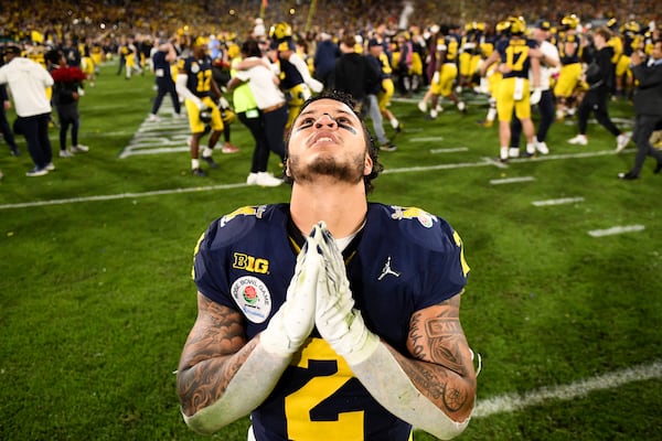 Michigan running back Blake Corum (2) gestures after an overtime win over Alabama at the Rose Bowl CFP NCAA semifinal college football game Monday, Jan. 1, 2024, in Pasadena, Calif. (AP Photo/Kyusung Gong)