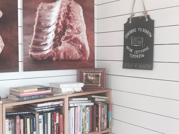 The cookbook lending library room at Smith Brothers Butcher Shop in Savannah. Besides meat, this boutique store stocks a fine selection of cheeses and regionally produced pantry perks. During lunch hours, it offers sandwiches using house-made meats like pastrami and roast beef on house-made bread. Photo by Ligaya Figueras. 