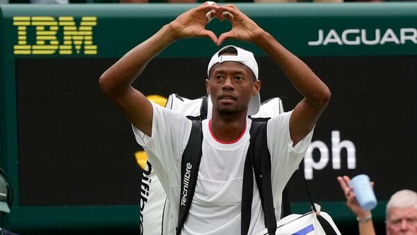 Christopher Eubanks of the US gestures to the crowd after losing to Russia's Daniil Medvedev in their men's singles match on day ten of the Wimbledon tennis championships in London, Wednesday, July 12, 2023. (AP Photo/Alastair Grant)