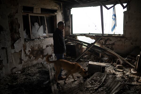 Naor Shamia, manager of the kibbutz emergency unit, stands at room of a house that was hit by a rocket fired from Lebanon, in the Kibbutz Manara, northern Israel, Thursday, Nov. 28, 2024. (AP Photo/Leo Correa)