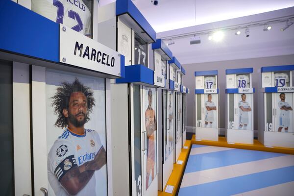 The Real Madrid first-team changing room lockers from Santiago Bernabeu Stadium are displayed at Sotheby's auction rooms in London, Wednesday, Nov. 20, 2024. The sale features 24 individual lockers previously used by footballers including Cristiano Ronaldo, David Beckham and Zinedine Zidane. (AP Photo/Kin Cheung)