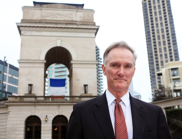 Rodney Cook stands in front of the Millennium Gate in Atlantic Station in downtown Atlanta. Cook’s nonprofit the National Monuments Foundation funded and built the landmark and museum. A bigger project, $25 million worth of statues and monuments in a park named after his father Rodney Cook Sr. Park, is a work in progress.