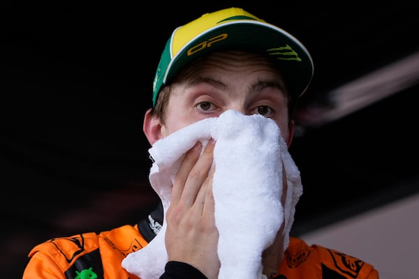 McLaren driver Oscar Piastri of Australia reacts following his second place finish in qualifying at the Australian Formula One Grand Prix at Albert Park, in Melbourne, Australia, Saturday, March 15, 2025. (AP Photo/Asanka Brendon Ratnayake)