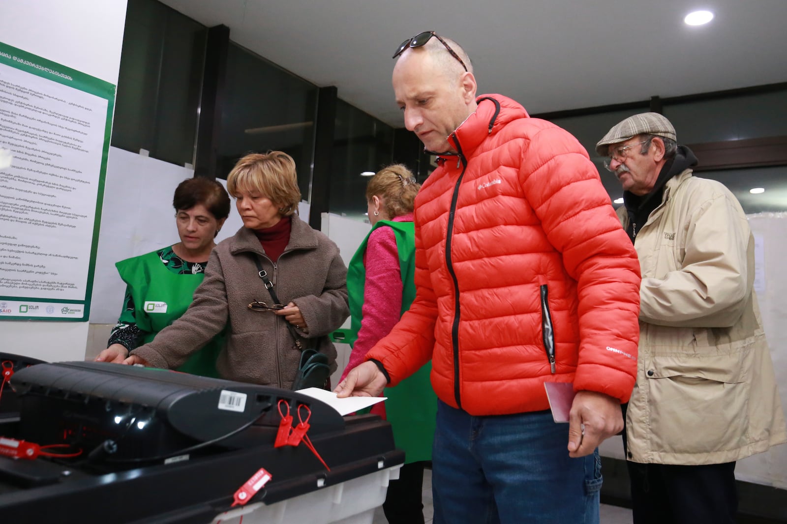 People cast their ballots at a polling station during the parliamentary election in Tbilisi, Georgia, Saturday, Oct. 26, 2024. (AP Photo/Zurab Tsertsvadze)