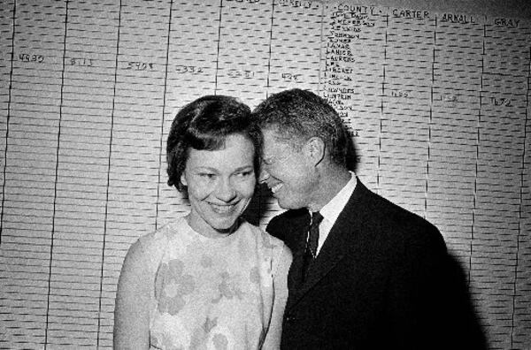 Then Georgia State Sen. Jimmy Carter hugs his wife, Rosalynn, at his Atlanta campaign headquarters in 1966 after making a strong showing in the Democratic primary election for governor of Georgia. File photo