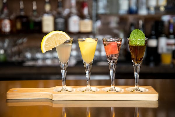  A flight of house-infused moonshine, with lemon, pineapple, spicy watermelon, and sweet tea, at Twisted Soul Cookhouse & Pours. Photo credit- Mia Yakel.