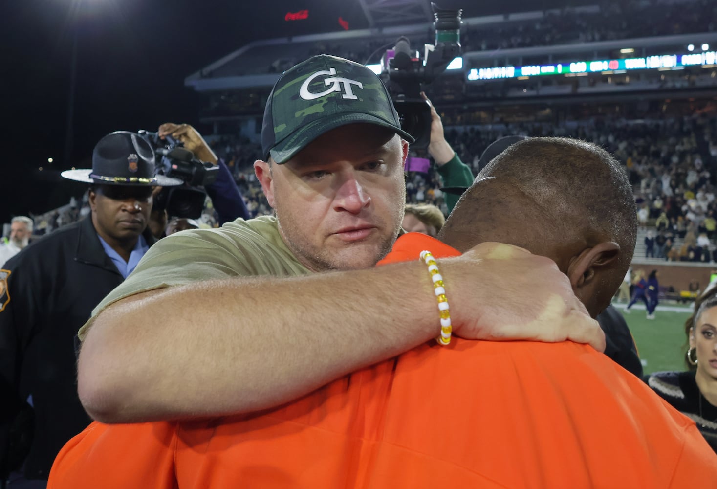 Georgia Tech Yellow Jackets head coach Brent Key talks with Syracuse Orange head coach Dino Babers after Tech won  31-22.  (Bob Andres for the Atlanta Journal Constitution)