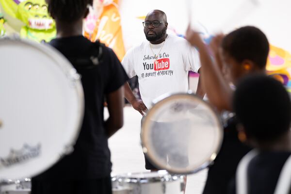 James Riles, executive director of the Atlanta Drum Academy, watches the junior members of the academy practice. The youngest members of the group are called the Lil' Rascalz. (Ben Gray / Ben@BenGray.com)